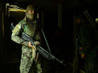 An Afghan Nation Army (ANA) soldier keeps watch as colleagues search a house during an operation in Bala Murghab district of Badghis province on March 26, 2017.