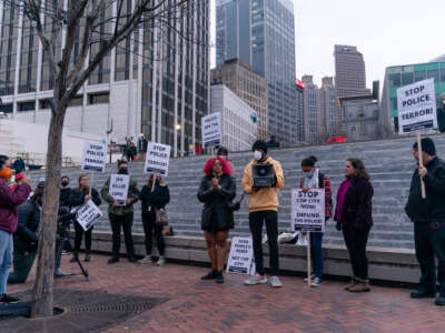 A woman speaks during a protest following the shooting death of Manuel Teran during a police raid on their encampment inside Weelaunee People's Park, the site of the proposed 'Cop City' training facility, earlier in the week, on January 21, 2022, in Atlanta, Georgia.