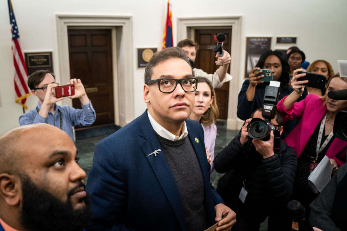 Reporters surround embattled Rep. George Santos as he heads to the House Chamber for a vote, at the U.S. Capitol on January 31, 2023, in Washington, D.C.