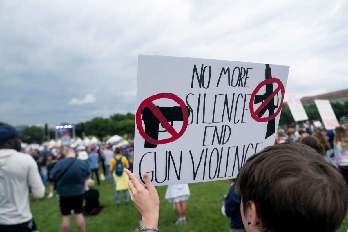 People gather during a rally decrying rising gun violence while urging politicians to take action in Washington, D.C., on June 11, 2022.