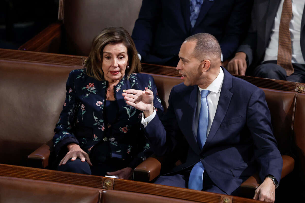 Democratic Leader Hakeem Jeffries and Rep. Nancy Pelosi speak to one another in the House Chamber at the U.S. Capitol Building on January 6, 2023, in Washington, D.C.