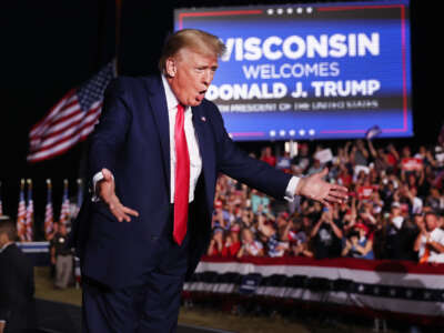 Former President Donald Trump greets supporters during a rally on August 5, 2022, in Waukesha, Wisconsin.