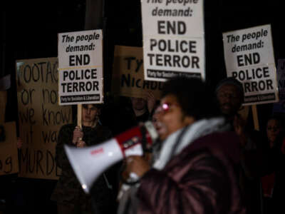 Demonstrators protest following the release of a police video showing officers beating Tyre Nichols in Memphis, Tennessee, on January 27, 2023.