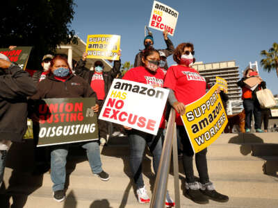 Union workers rally in downtown Los Angeles in support of unionizing Amazon workers in Alabama, on March 22, 2021, in Los Angeles, California.