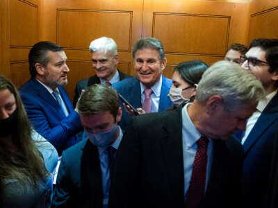 Senators Joe Manchin, Ted Cruz, John Hoeven and Bill Cassidy are seen during a Senate vote in the U.S. Capitol on September 22, 2021.