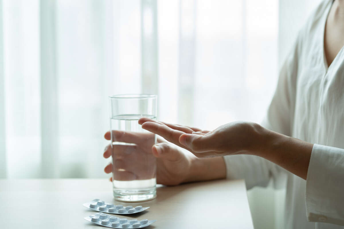 Woman taking pills