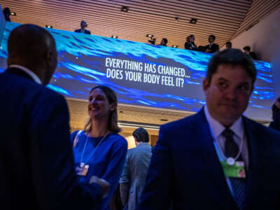 Participants of the World Economic Forum (WEF) stand in the Congress centre during the WEF's annual meeting in Davos on January 18, 2023.