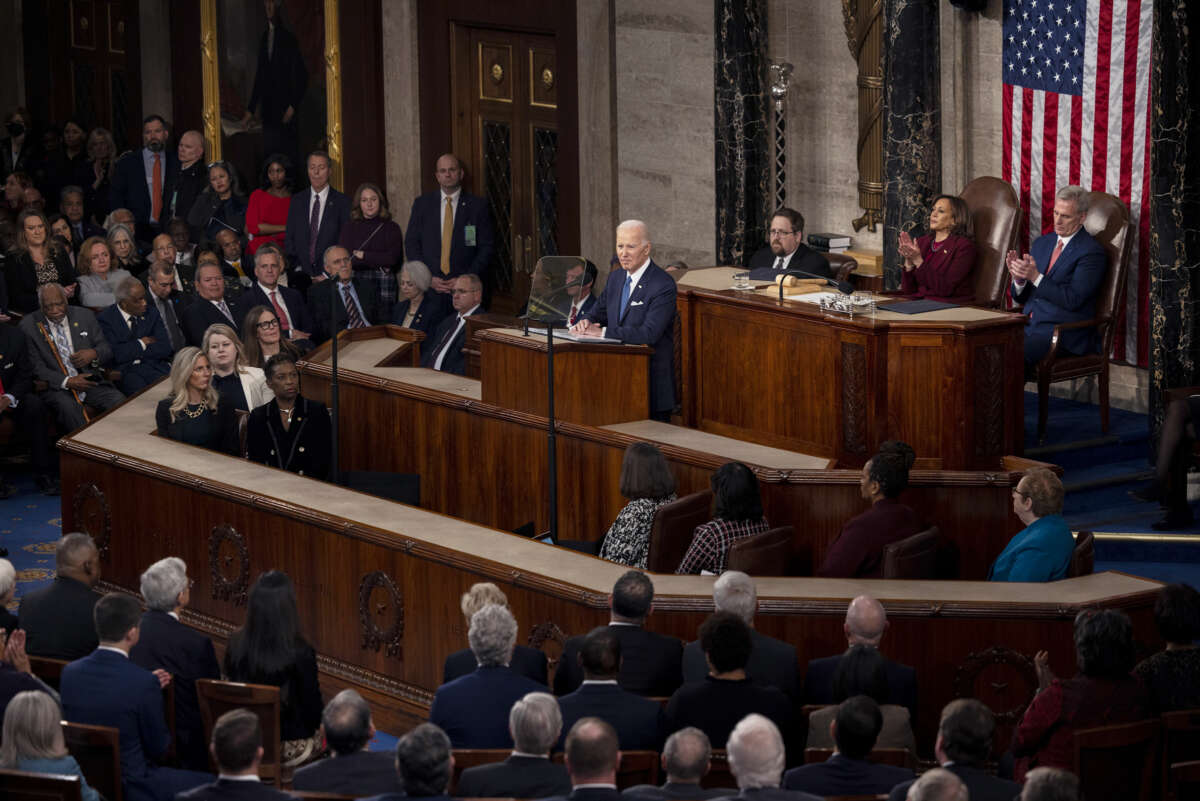 Joe Biden stands to deliver the state of the union address