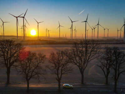 The sun rises over a wind energy park in Brandenburg, Germany, on February 7, 2023.