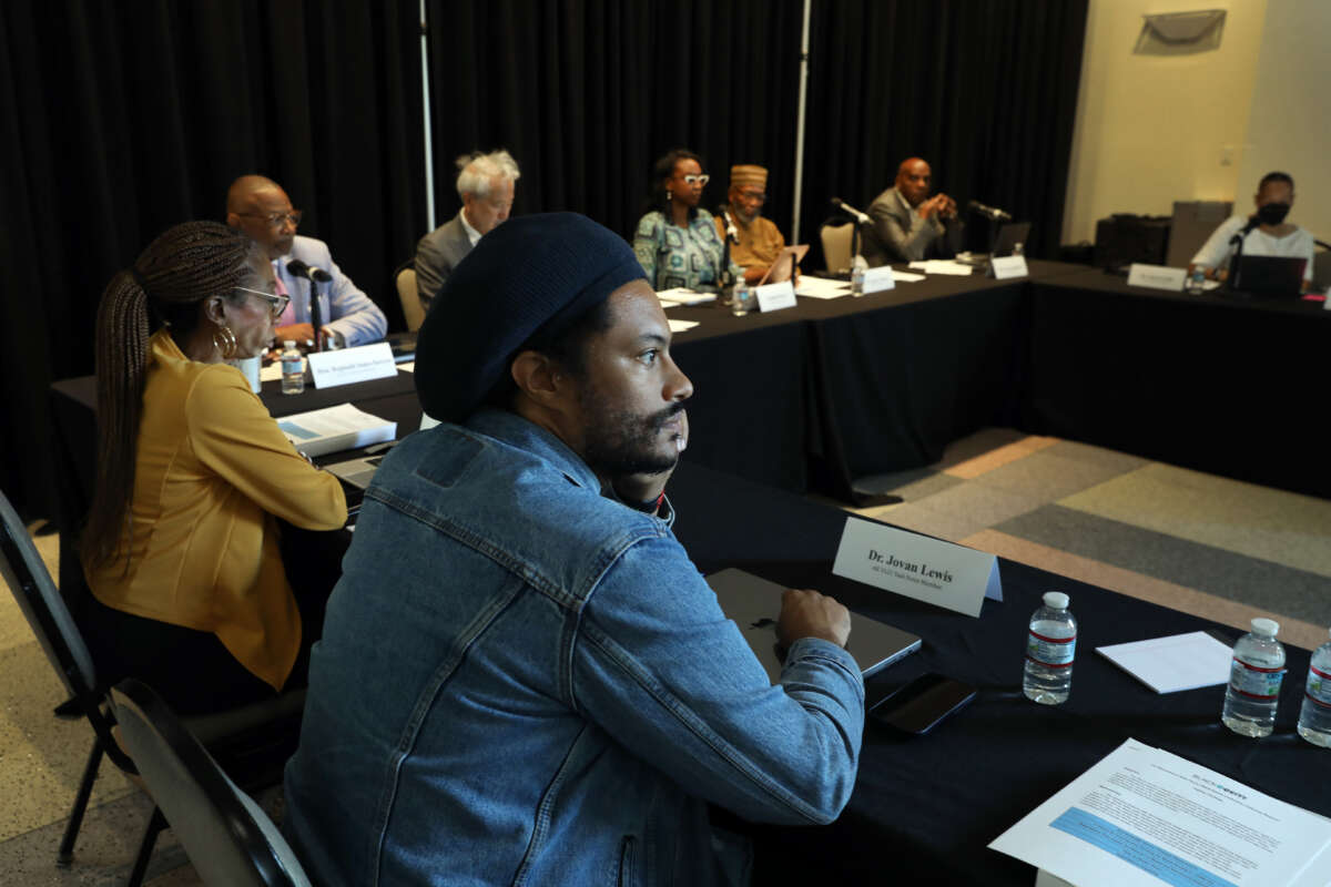 Dr. Jovan Lewis, center, listens during as the California Reparations Task Force meets to hear public input on reparations at the California Science Center in Los Angeles, California, on September 22, 2022.