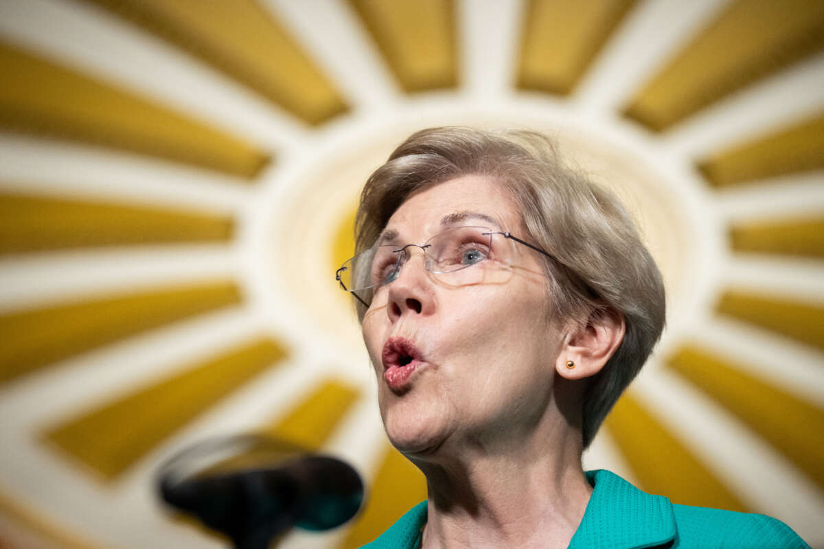 Sen. Elizabeth Warren speaks during the Senate Democrats press conference beneath the freshly repainted Ohio Clock Corridor ceiling in the Capitol on September 7, 2022.