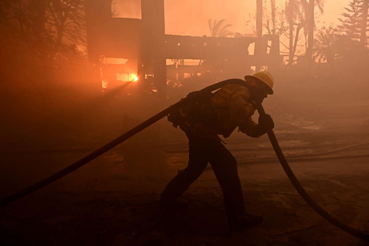 Firefighters battle the Coastal fire at Coronado Pointe in Laguna Niguel, California, on May 11, 2022.