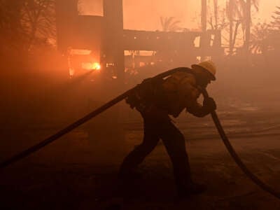 Firefighters battle the Coastal fire at Coronado Pointe in Laguna Niguel, California, on May 11, 2022.