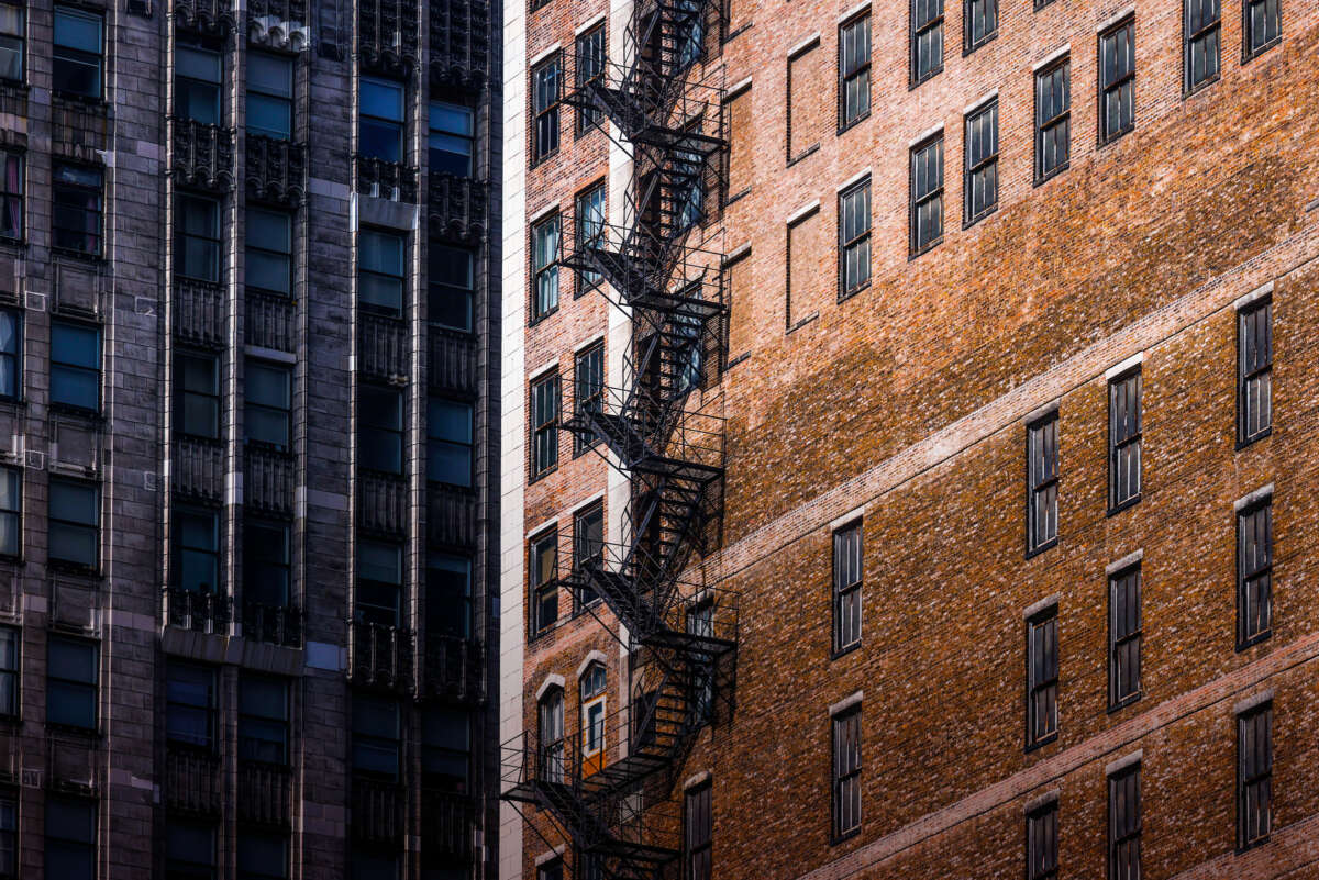 The exterior fire escape stairwell of a Chicago highrise building is seen at great height