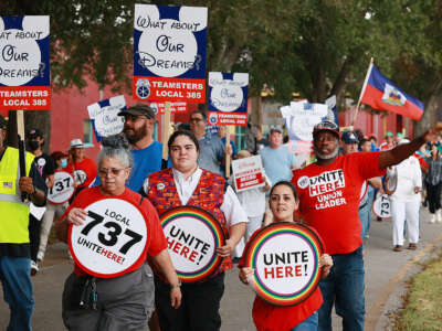 Hundreds of Disney workers march along Maingate Lane and U.S. Highway 192 in Kissimmee, Florida, on November 30, 2022.