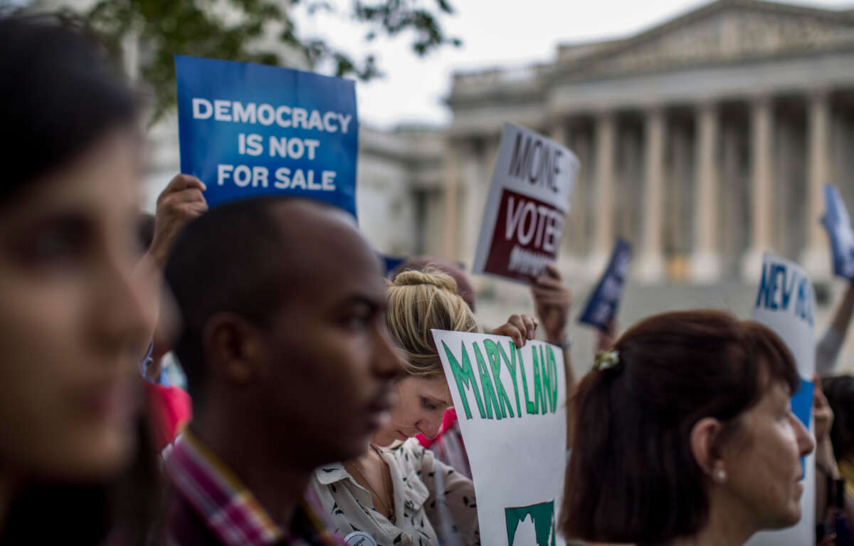 Lawmakers gather along with lobbying groups, for a press conference to discuss a constitutional amendment on campaign finance reform overturning Citizens United on Capitol Hill in Washington, D.C., on September 8, 2014.