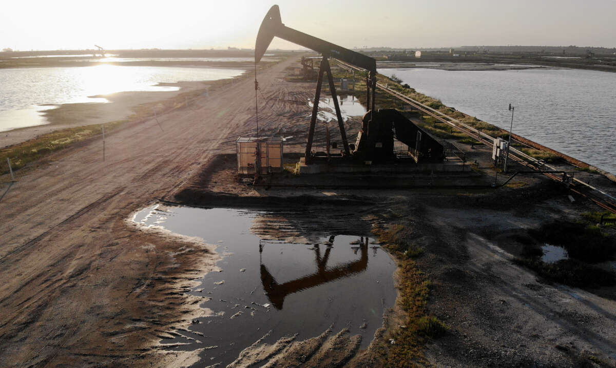 An aerial view shows an oil pumpjack at the Huntington Beach Oil Field on April 20, 2020, in Huntington Beach, California.