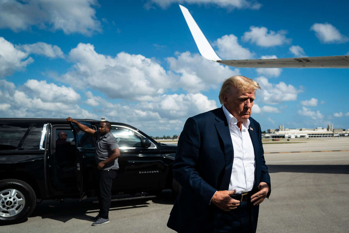 Former President Donald Trump boards his airplane at Palm Beach International Airport on February 22, 2023, in West Palm Beach, Florida.