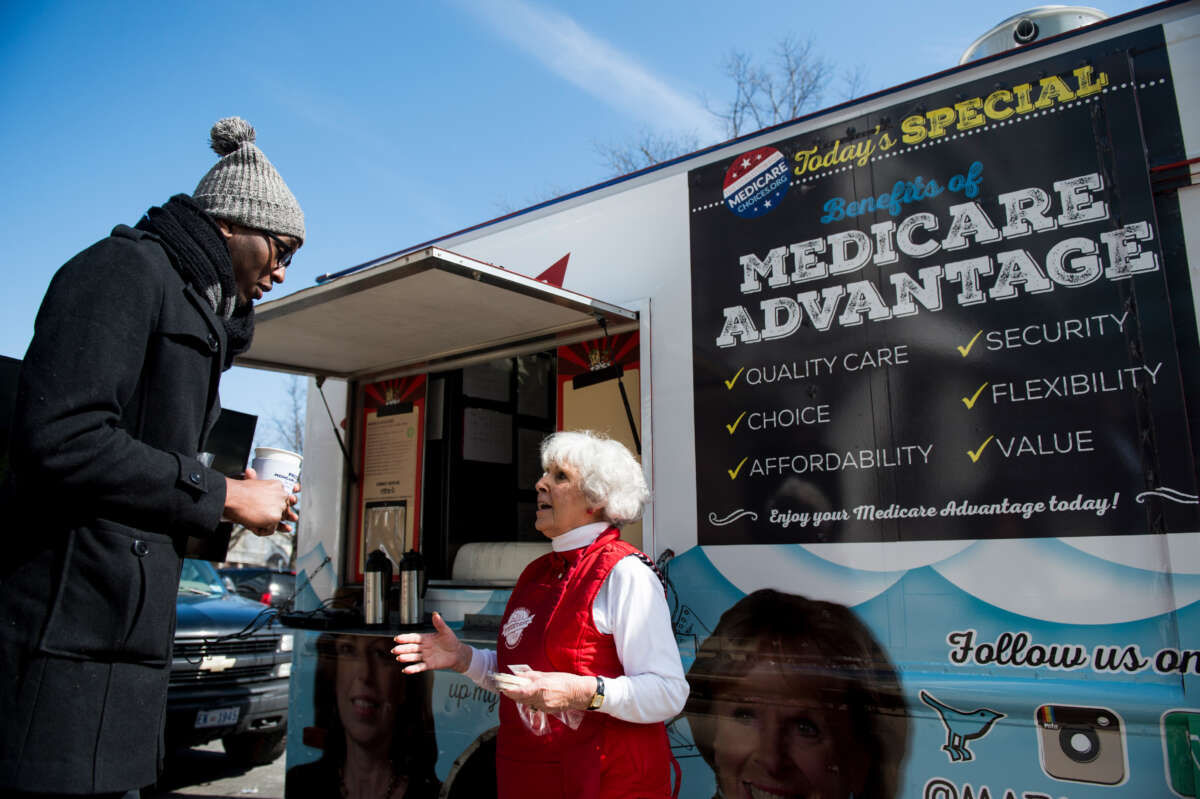 Carol Berman, of West Palm Beach, Florida, speaks with pedestrians about Medicare Advantage during the Coalition for Medicare Choices' Medicare Advantage Food Truck stop on North Capitol Street in Washington, D.C., on March 9, 2015.