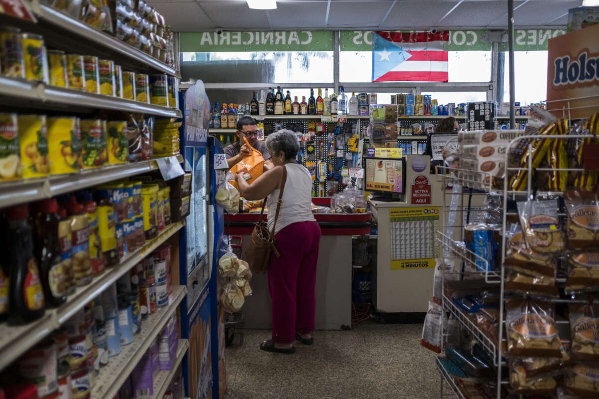 Customers do their groceries shopping at Agranel Supermarket in Manati, Puerto Rico, on March 20, 2019.