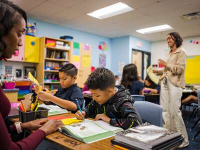 Aisha Thomas (L) learns teaching skills in her classroom in Nevitt Elementary School, in Phoenix, Arizona, on October 26, 2022.