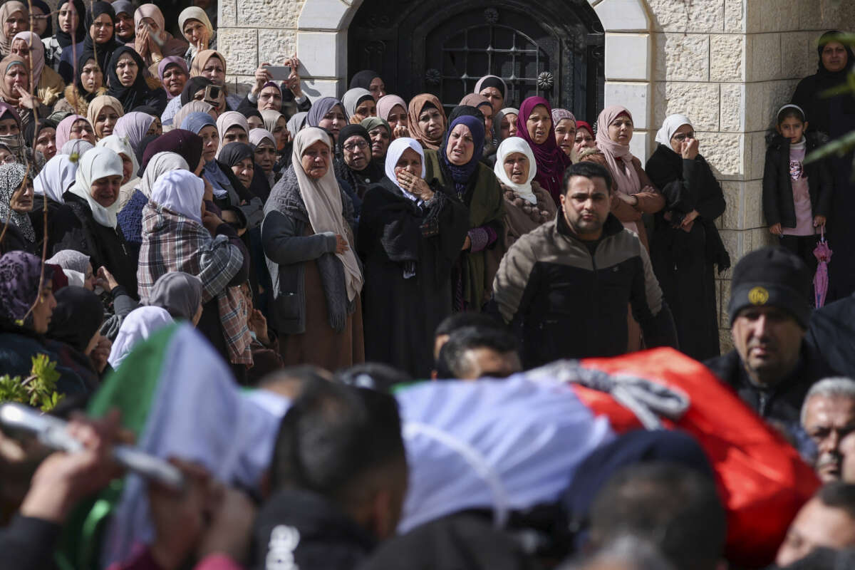 Palestinians mourn during the funeral of Abdullah Sami Qalalweh at his village of al-Judaydeh south of Jenin in the occupied West Bank, on February 4, 2023.