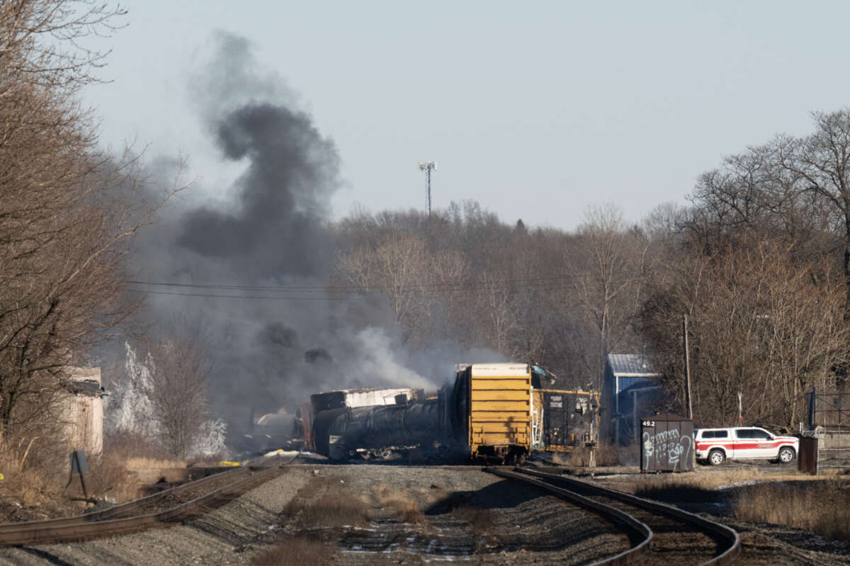 Smoke rises from a derailed cargo train in East Palestine, Ohio, on February 4, 2023.