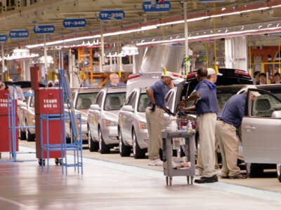 Cars rolls down the assembly line during the grand opening ceremony of the Hyundai plant in Montgomery, Alabama on May 20, 2005.