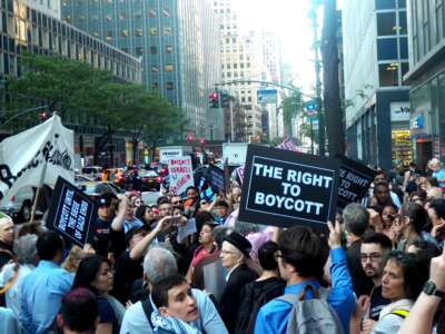 Around 300 people protest Governor Andrew Cuomo's executive order requiring state agencies to divest from organizations that support the Palestinian call for boycott, divestment, and sanctions, on June 9, 2016, in New York City.