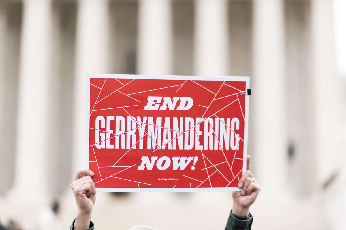 Sign that says "End gerrymandering now" in front of Supreme Court