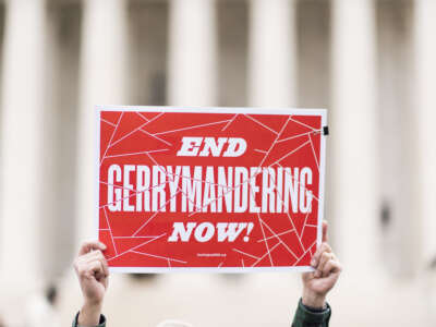 Sign that says "End gerrymandering now" in front of Supreme Court