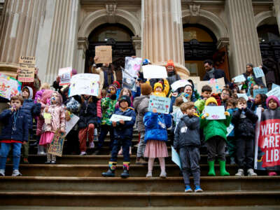 Students rally on the steps of the New York City Department of Education, demanding a librarian for their school and all other NYC public school students.