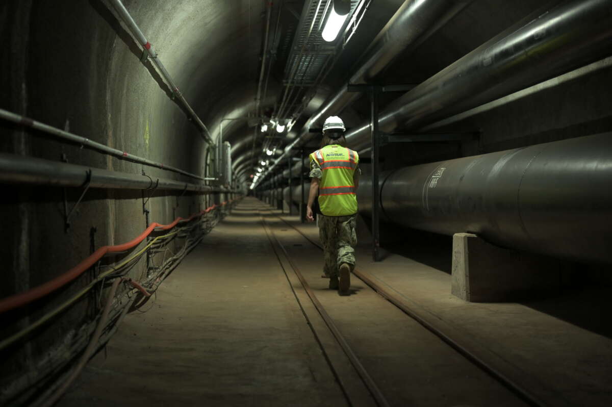 Navy Lt. Cmdr. Shannon Bencs walks a portion of the seven miles of tunnels at the Red Hill Underground Fuel Storage Facility in Honolulu, Hawaii, on July 17, 2020.