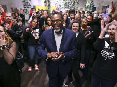 Brandon Johnson celebrates with supporters