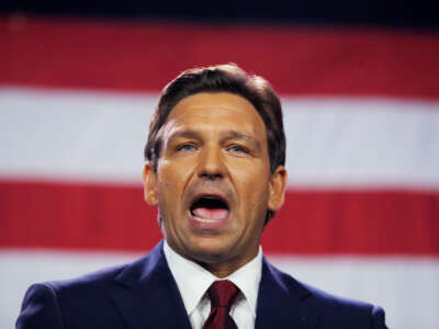 Ron Desantis speaks in front of the u.s. flag