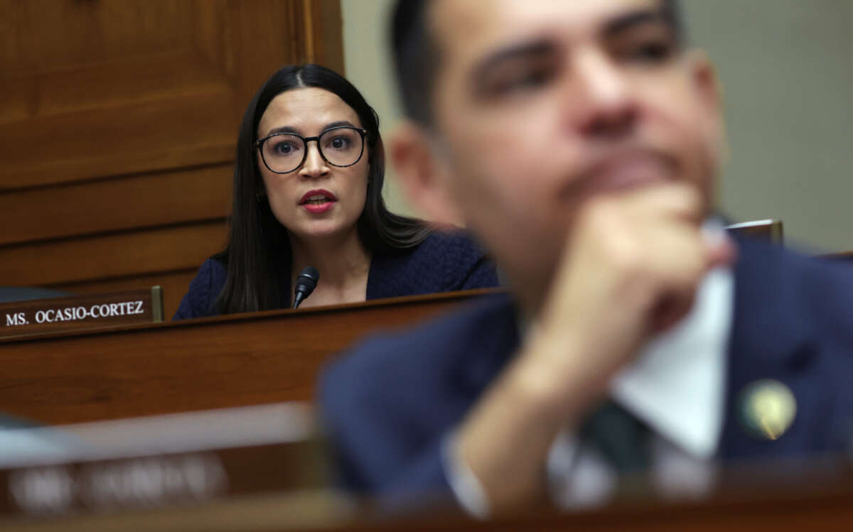 Rep. Alexandria Ocasio-Cortez, left, listens during a hearing before the House Oversight and Accountability Committee at Rayburn House Office Building on Capitol Hill on February 8, 2023, in Washington, D.C.
