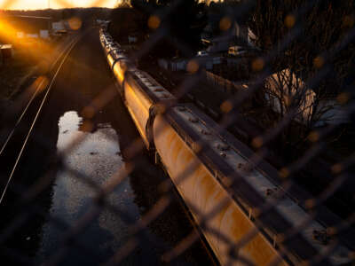 A Norfolk Southern train passes underneath a bridge on February 25, 2023, in East Palestine, Ohio.