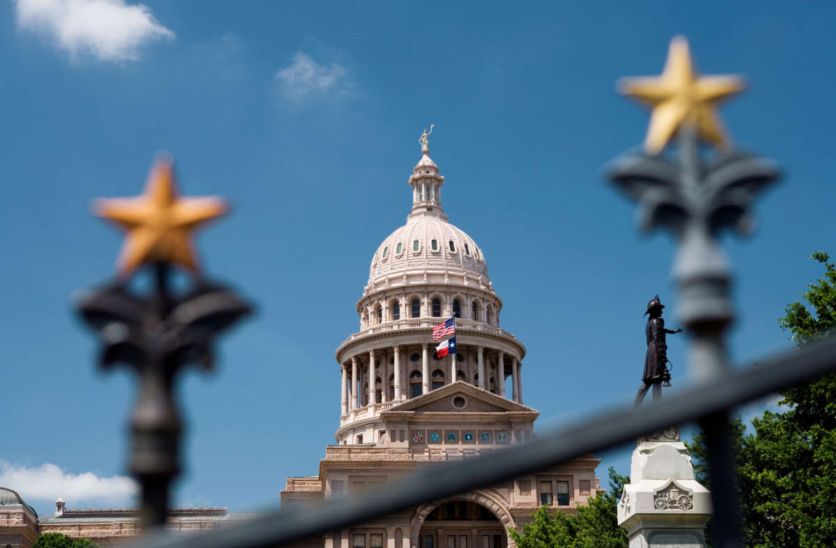The Texas State Capitol building is pictured behind a gate in Austin, Texas.