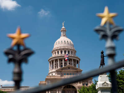 The Texas State Capitol building is pictured behind a gate in Austin, Texas.