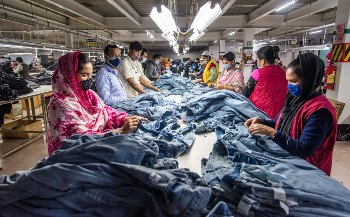 Garment workers manufacture clothes in Dhaka, Bangladesh, on August 29, 2022, in Dhaka, Bangladesh.