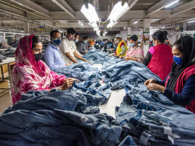 Garment workers manufacture clothes in Dhaka, Bangladesh, on August 29, 2022, in Dhaka, Bangladesh.
