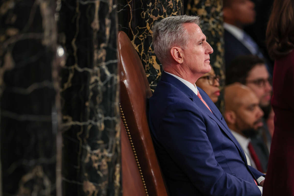 Speaker of the House Kevin McCarthy listens as President Joe Biden delivers his State of the Union address during a joint meeting of Congress in the House Chamber of the U.S. Capitol on February 7, 2023, in Washington, D.C.