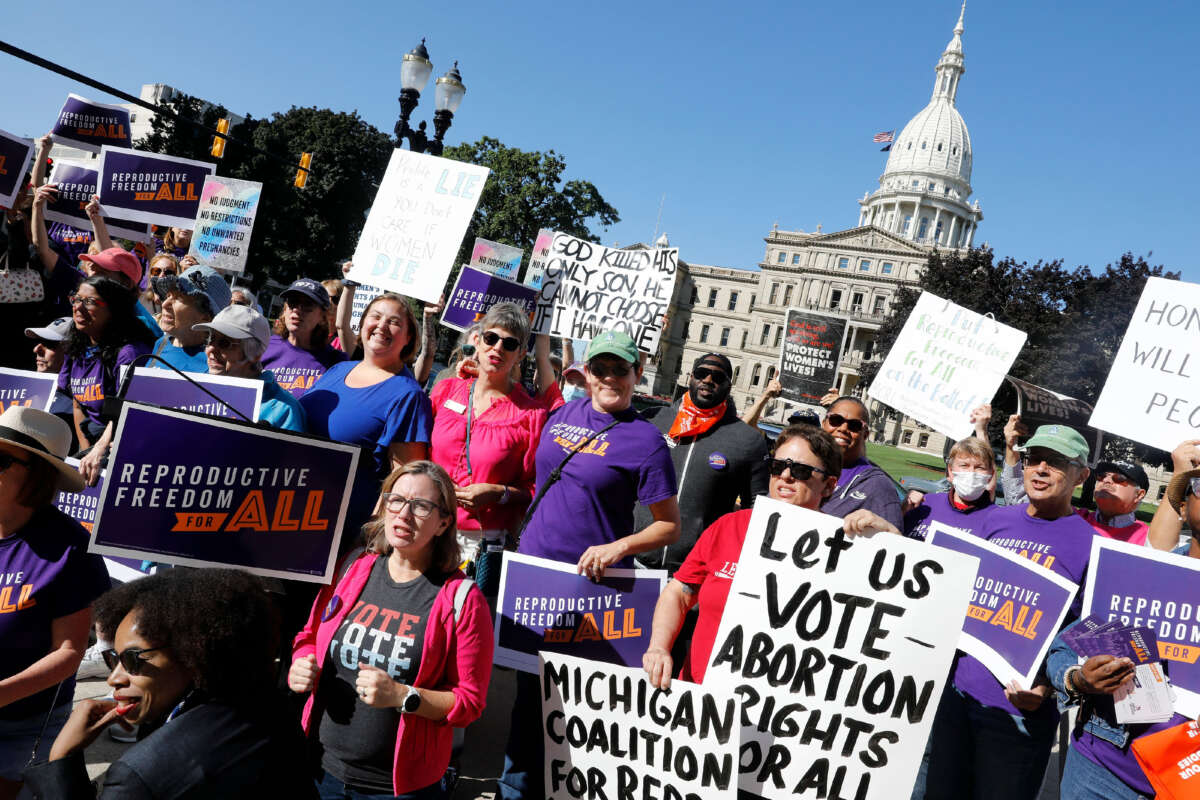 Pro-choice supporters gather outside the Michigan State Capitol during a Restore Roe rally in Lansing, Michigan, on September 7, 2022.