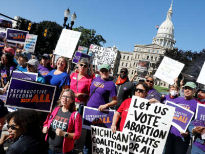 Pro-choice supporters gather outside the Michigan State Capitol during a Restore Roe rally in Lansing, Michigan, on September 7, 2022.