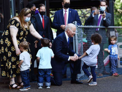 President Joe Biden is greeted by children at the Capitol Child Development Center in Hartford, Connecticut, on October 15, 2021.