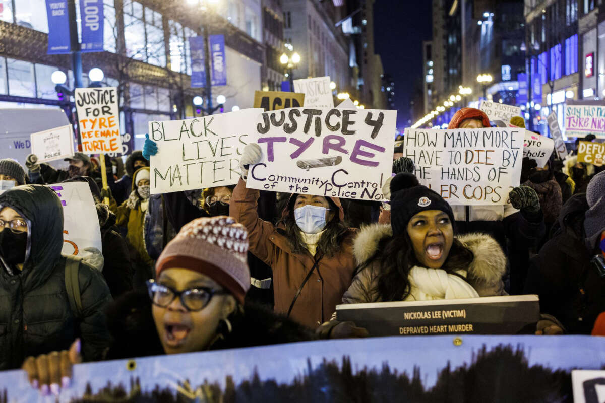 People march on State Street in Chicago's Loop on January 30, 2023, to protest the police killing of Tyre Nichols.