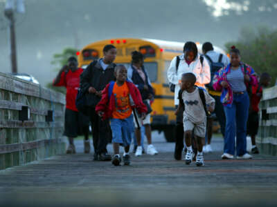 Children on Sapelo Island cross the dock to board the ferry that takes them to the mainland for school.