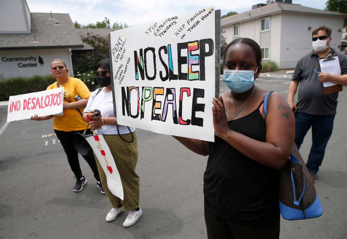Tenants rally at the Delta Pines apartment complex in Antioch, California, on June 22, 2022.