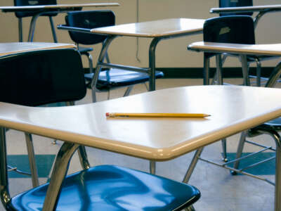 Classroom desk with pencil