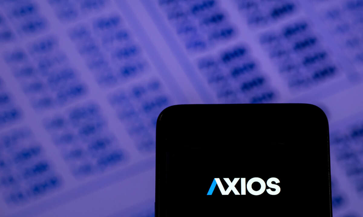 The Axios logo is pictured on a cell phone
